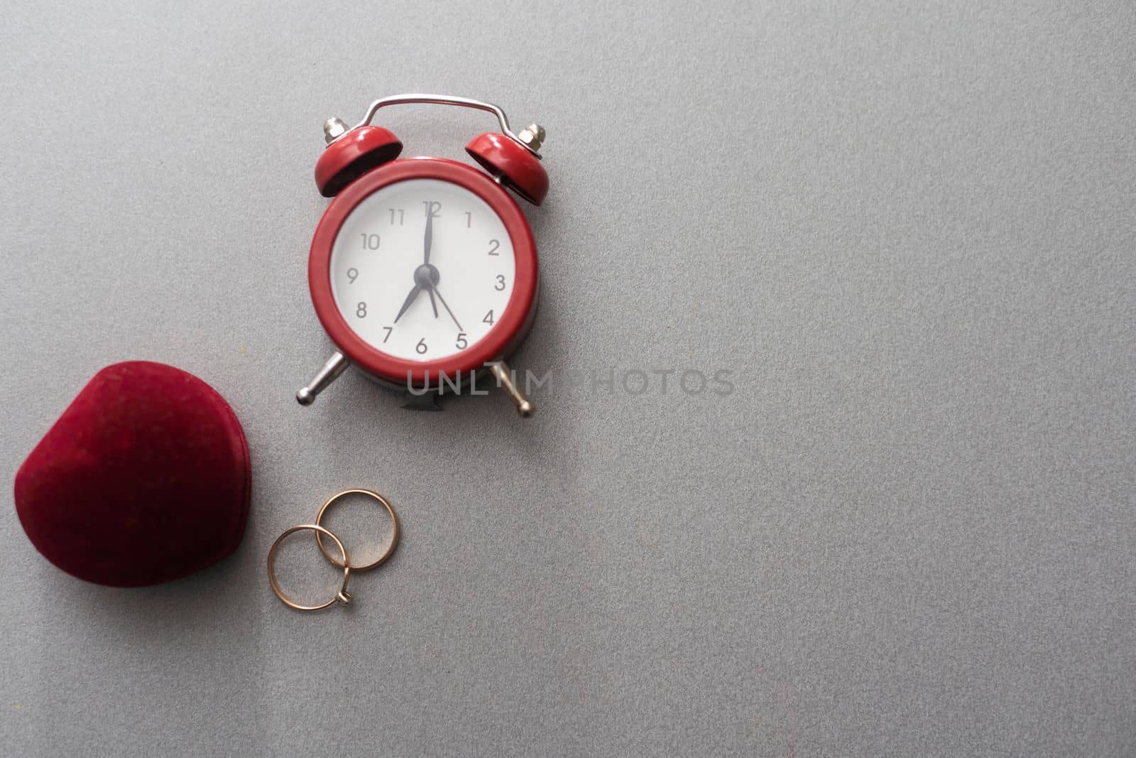 Wedding rings and alarm clock, wedding time concept