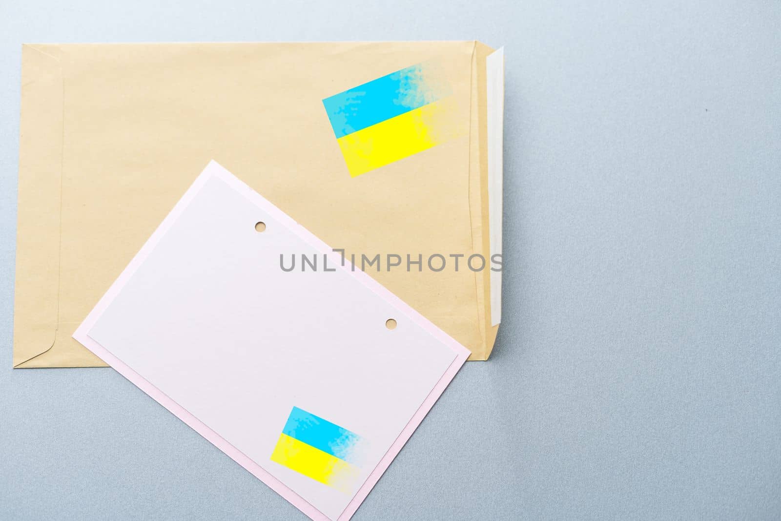 Envelope and the Ukrainian flag. Stop the war concept isolated background. by Andelov13