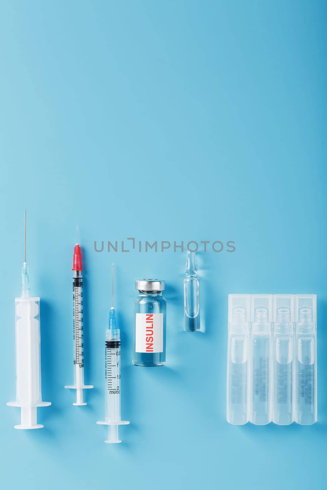 Medicine in ampoules with insulin, needles and syringes for medical subcutaneous injection by AlexGrec