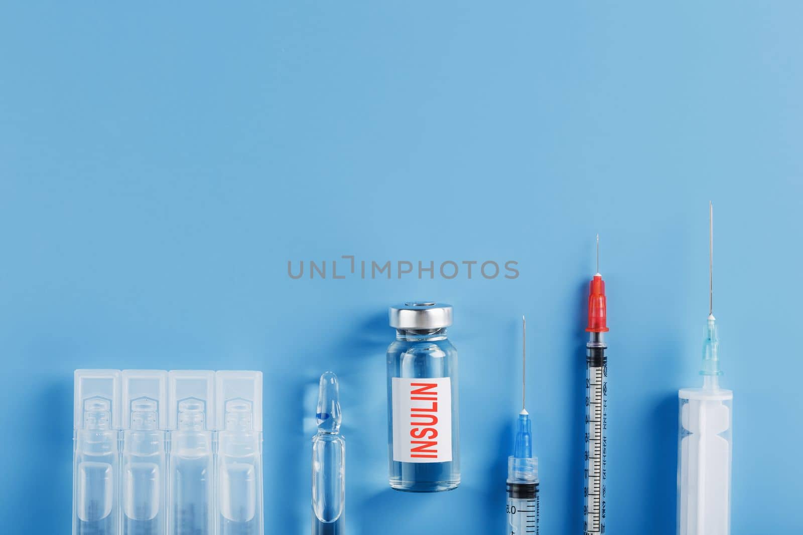 Medicine in ampoules with insulin, needles and syringes for medical subcutaneous injection by AlexGrec