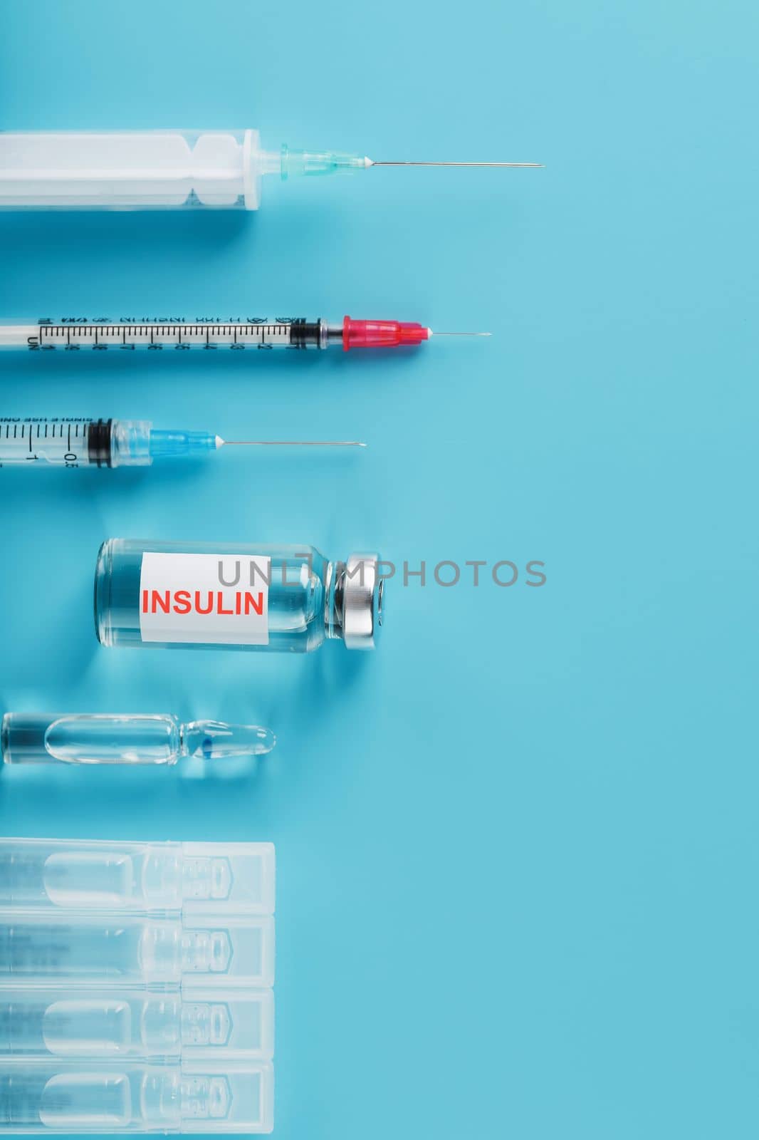 Medicine in ampoules with insulin, needles and syringes for medical subcutaneous injection by AlexGrec