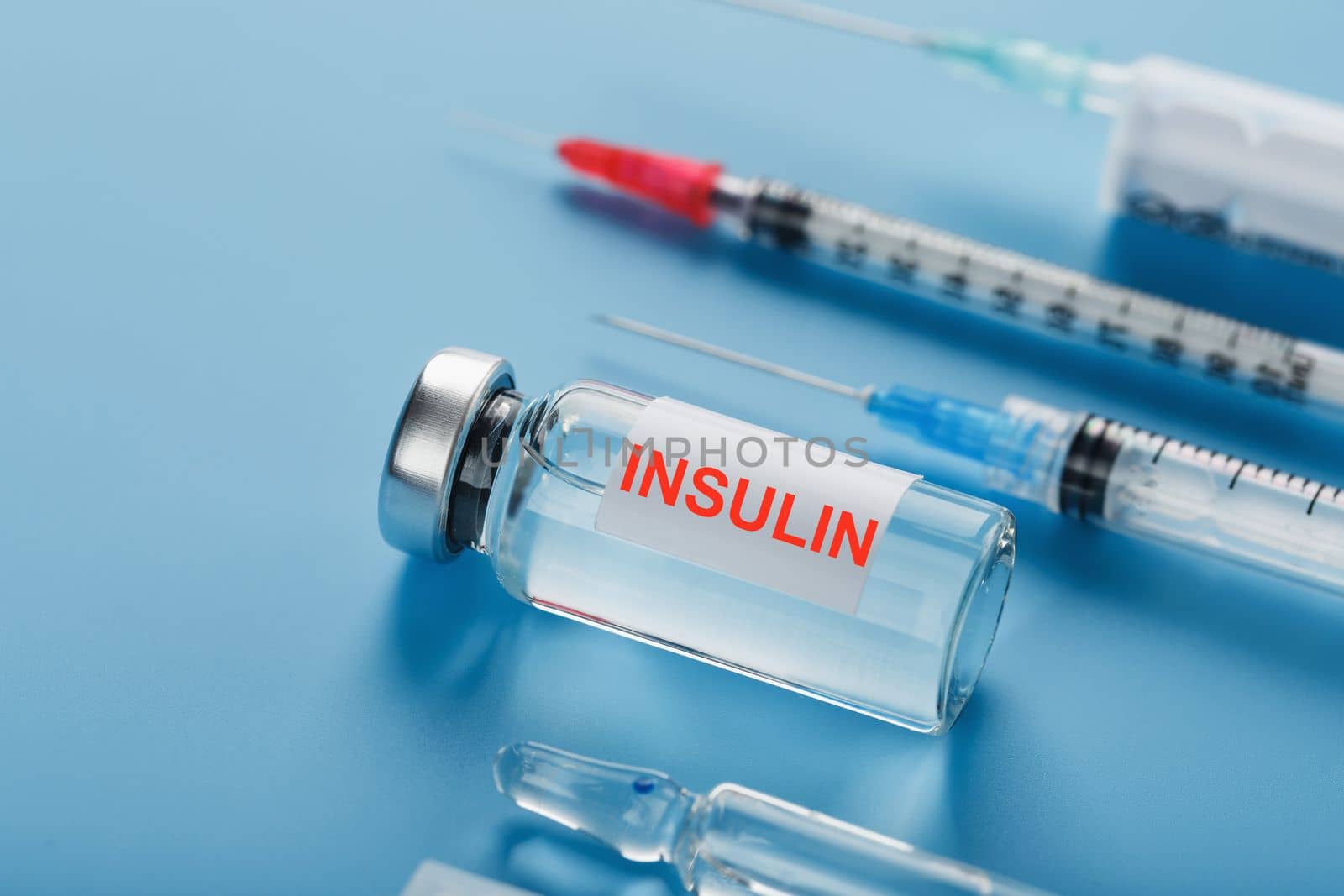 Medicine in ampoules with insulin, needles and syringes for medical subcutaneous injection by AlexGrec