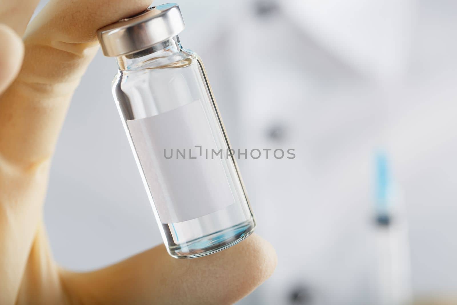 The doctor holds a syringe for injections and an ampoule with insulin for the treatment of Diabetes by AlexGrec