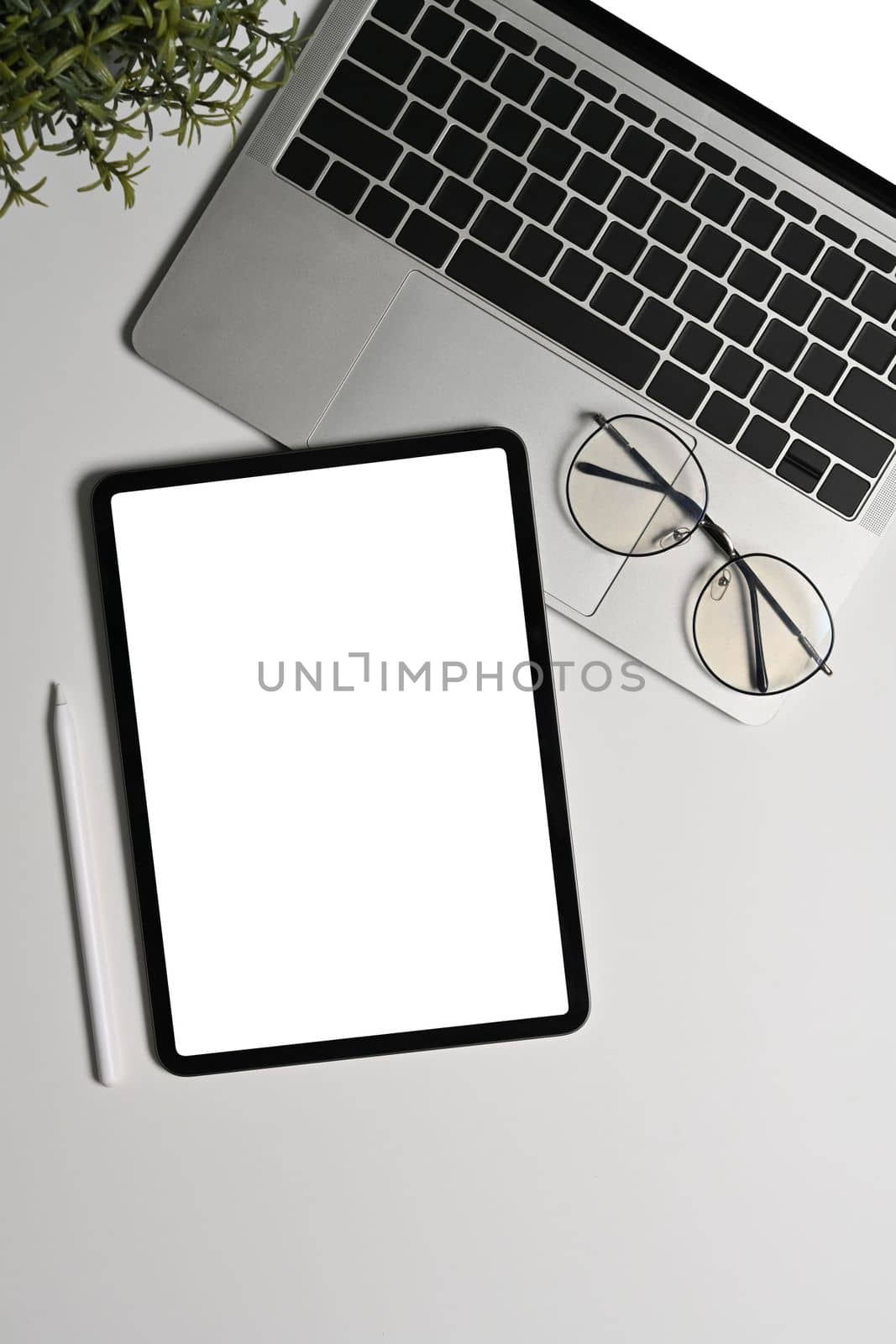 Mock up digital tablet, laptop computer and glasses on white background.