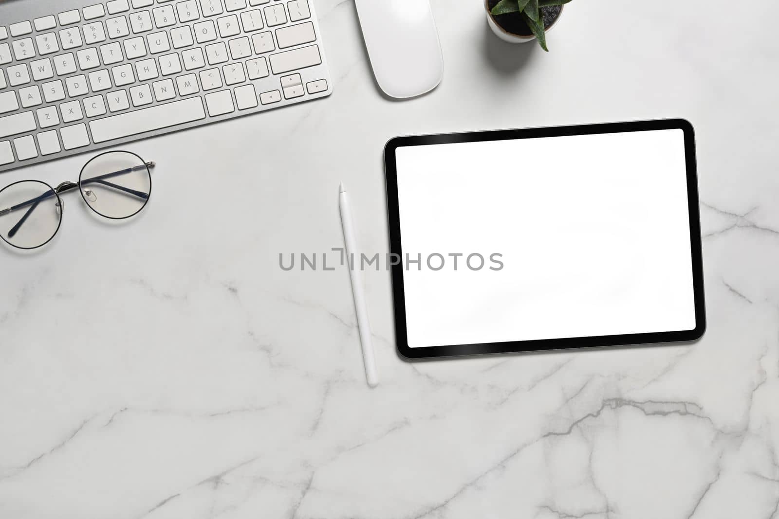 Top view mock up digital tablet with white screen and stylus pen on marble background. by prathanchorruangsak