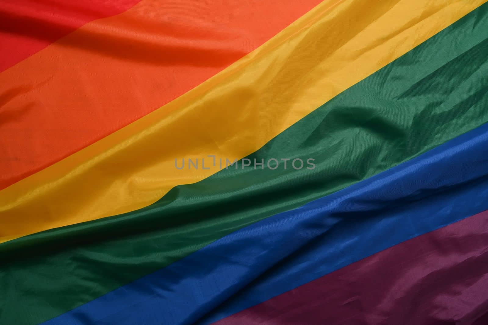 Colorful rainbow flag, symbol for the LGBT community. by prathanchorruangsak