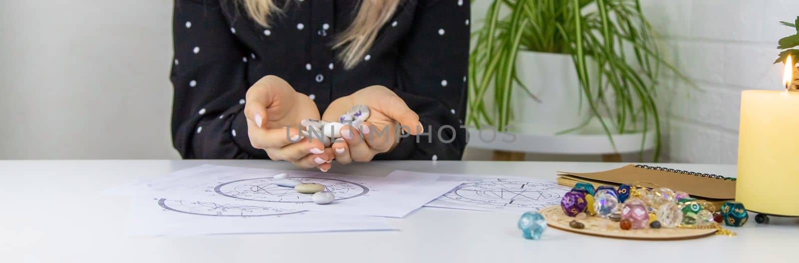 Woman numerologist astrologer counts numbers. Selective focus. People.
