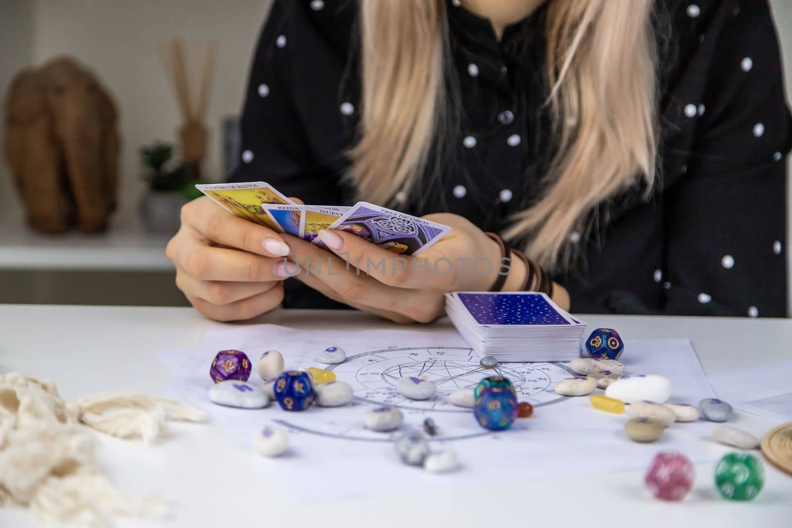Woman astrologer draws a natal chart. Selective focus. People.