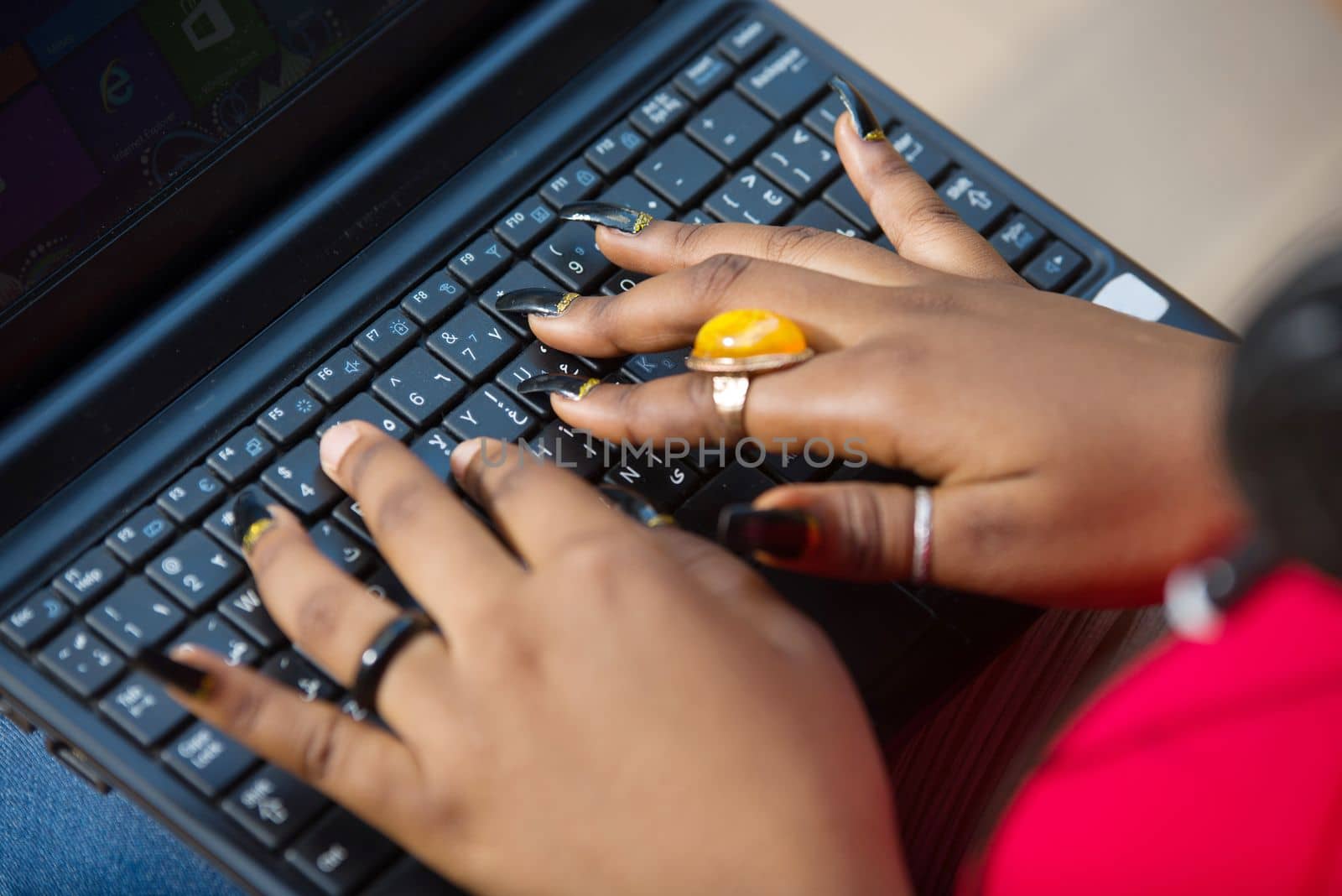 female hands on laptop keyboards.