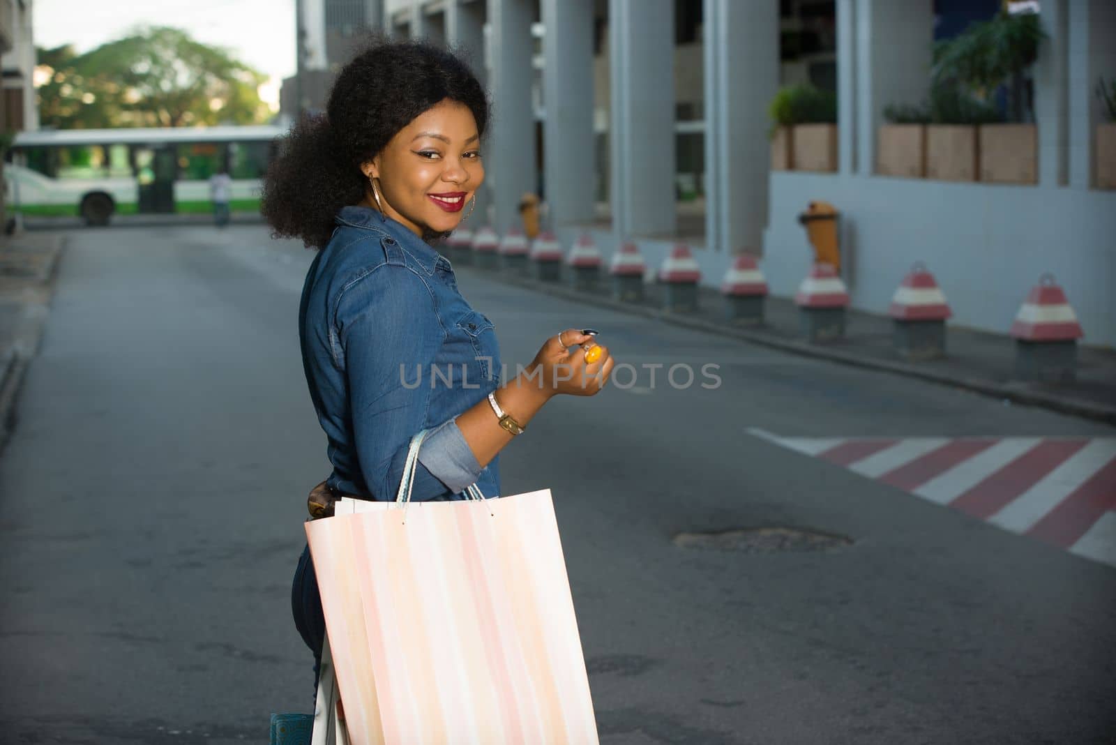 Happy Shopping, beautiful young woman holding bags on the street buying in the city.