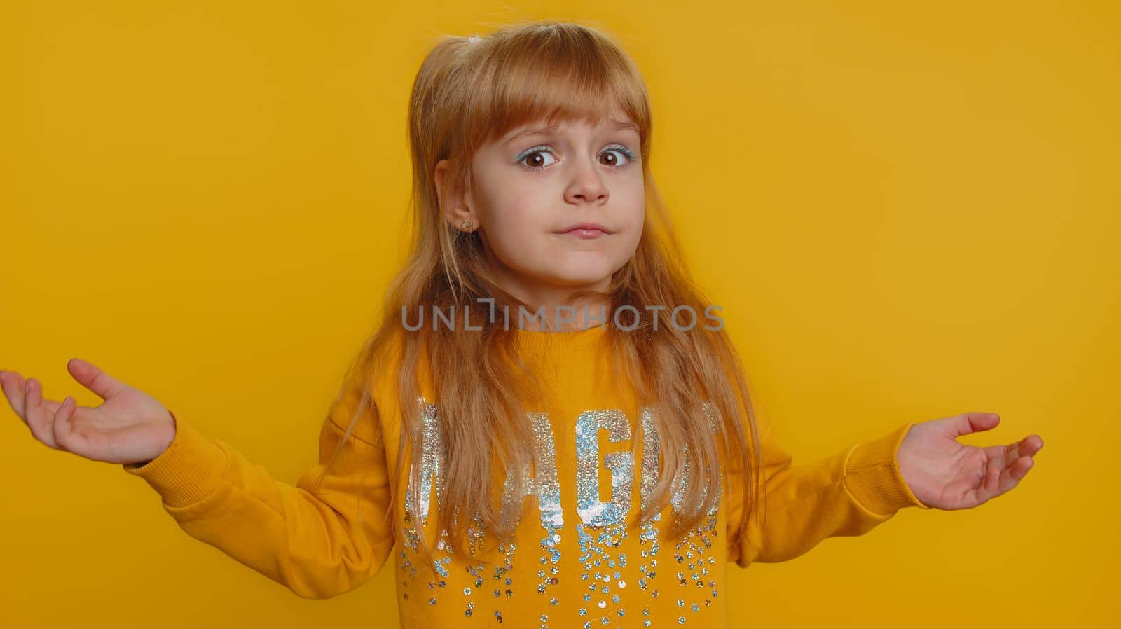 Dont want to hear, listen. Frustrated annoyed irritated young toddler school girl in sweater covering ears, gesturing No, avoiding advice ignoring unpleasant noise loud voices. Teen female child kid