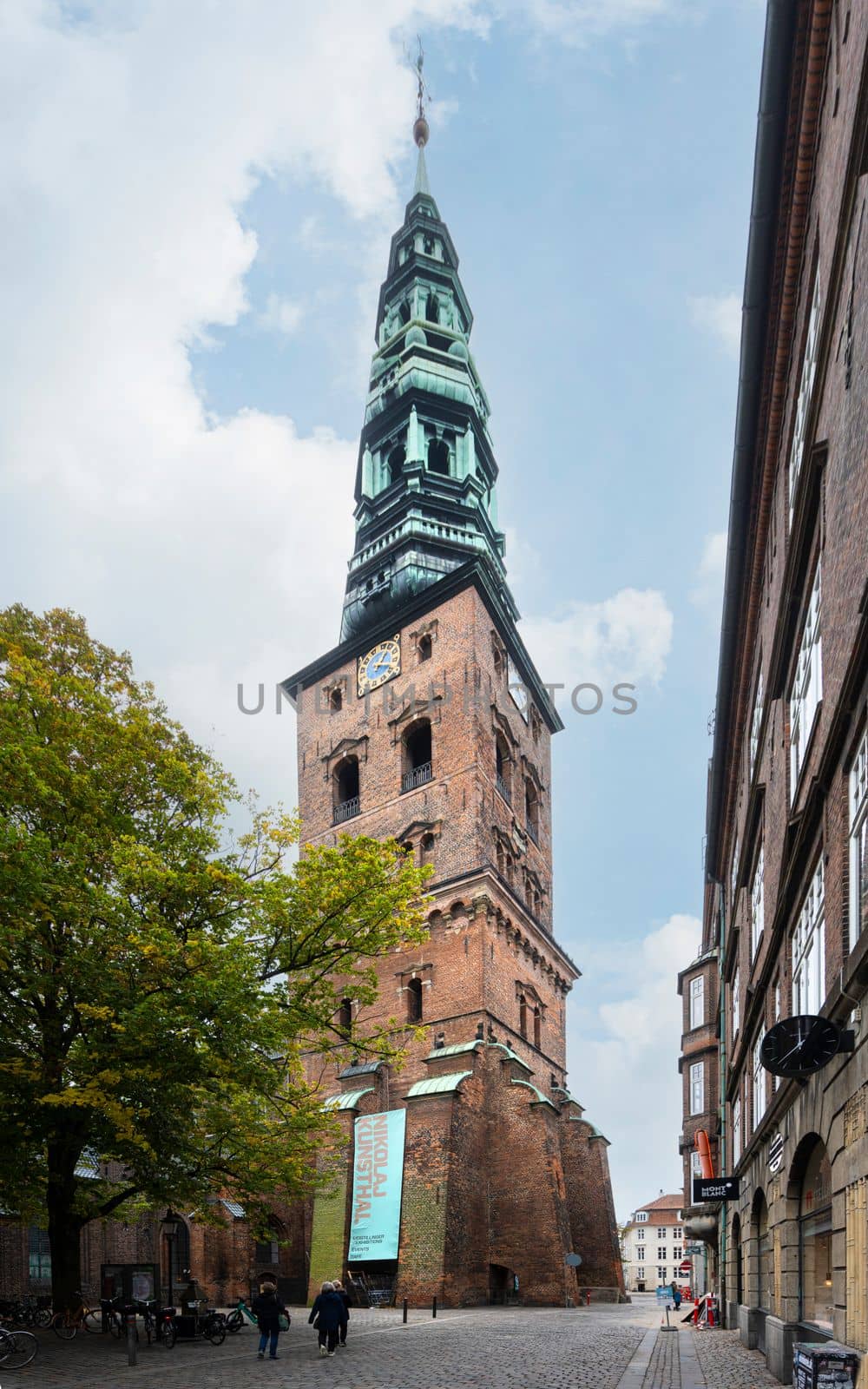 Copenhagen, Denmark. October 2022. the bell tower of the former church and now Nikolaj, Copenhagen Contemporary Art Center in the city center