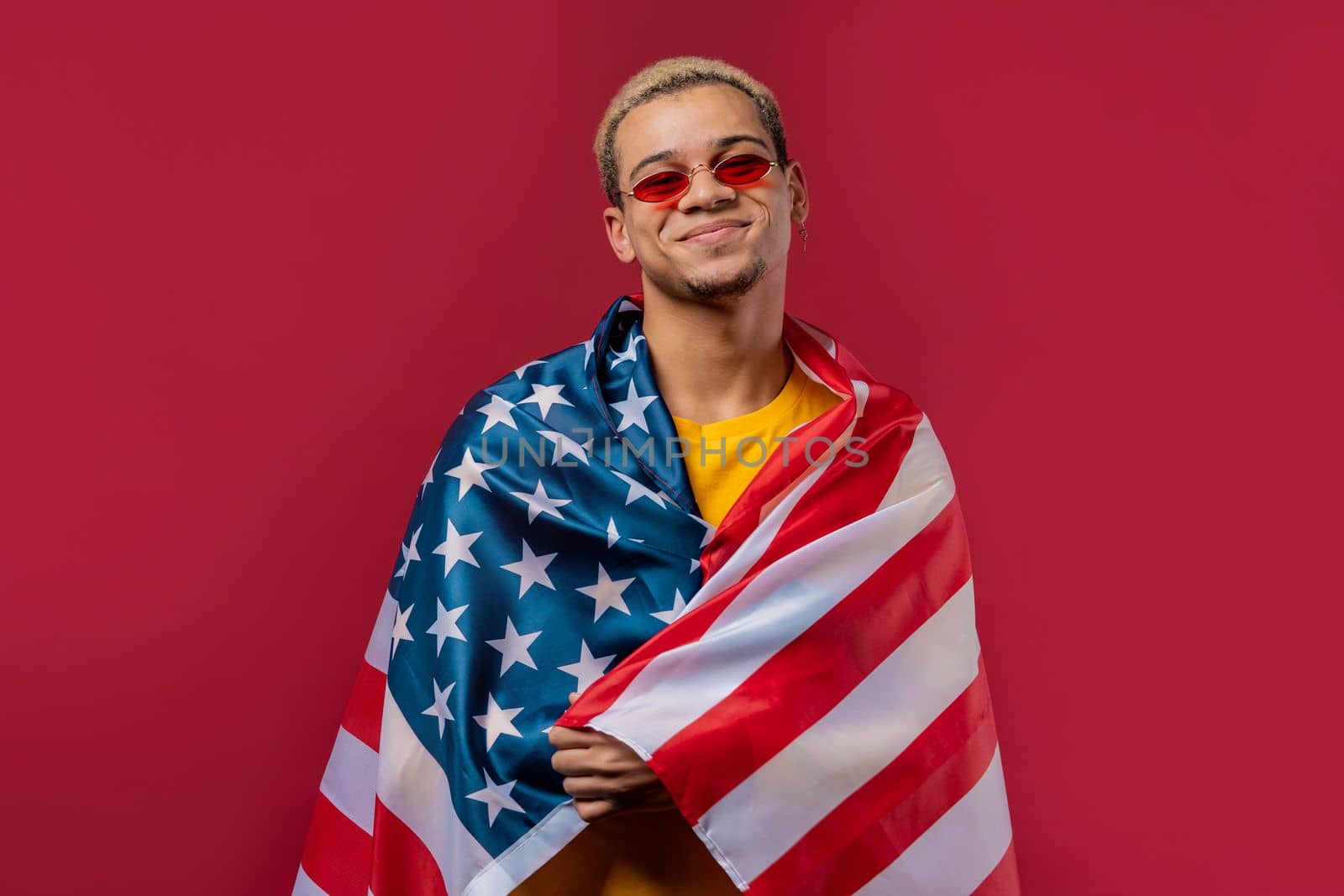 Happy man with national USA flag on red background. American patriot, 4th of July - Independence day celebration, election, America, labor. US banner. by kristina_kokhanova