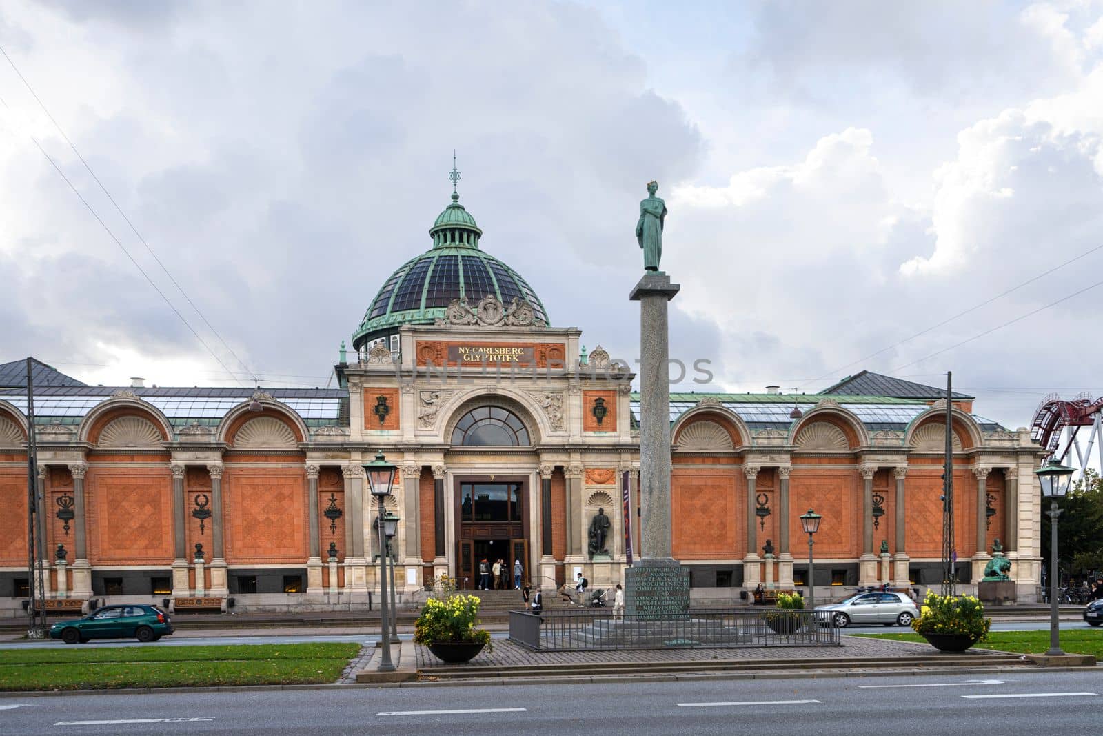 Copenhagen, Denmark. October 2022.  Exterior view of the Ny Carlsberg Glyptotek exhibition center with the Dante Alighieri column in the city center