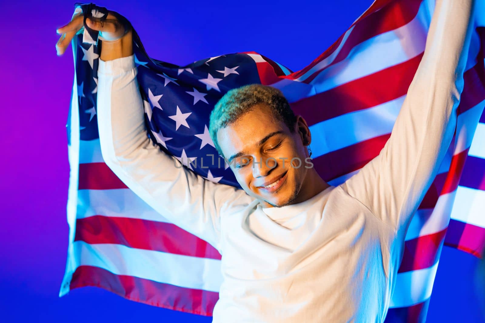 Happy dancing man with national USA flag. American patriot, 4th of July - Independence day celebration, election, America, labor. US banner. High quality photo