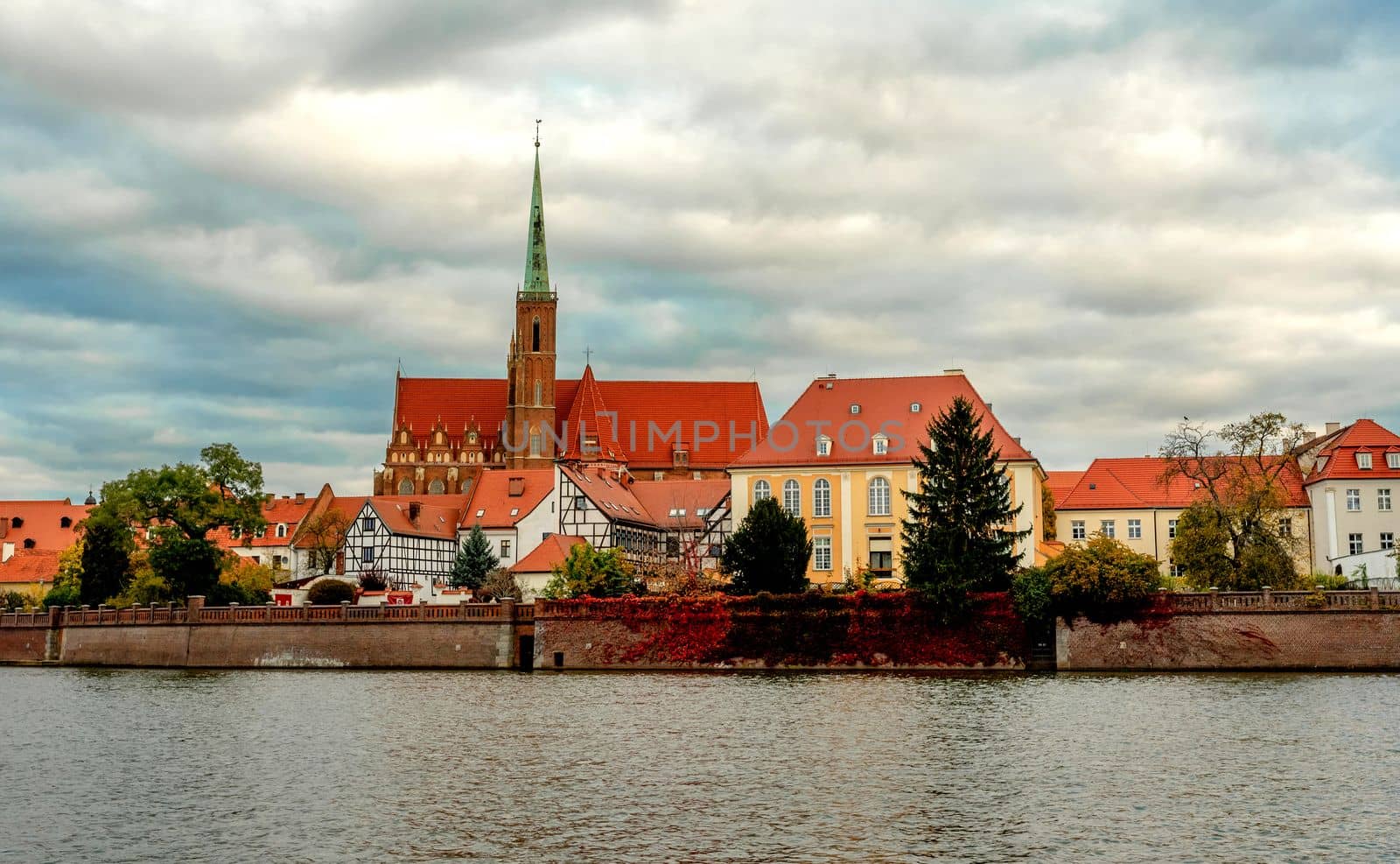 Wroclaw Poland view at Tumski island and Cathedral of St John the Baptist with bridge through river Odra. Picturesque landscape autumn