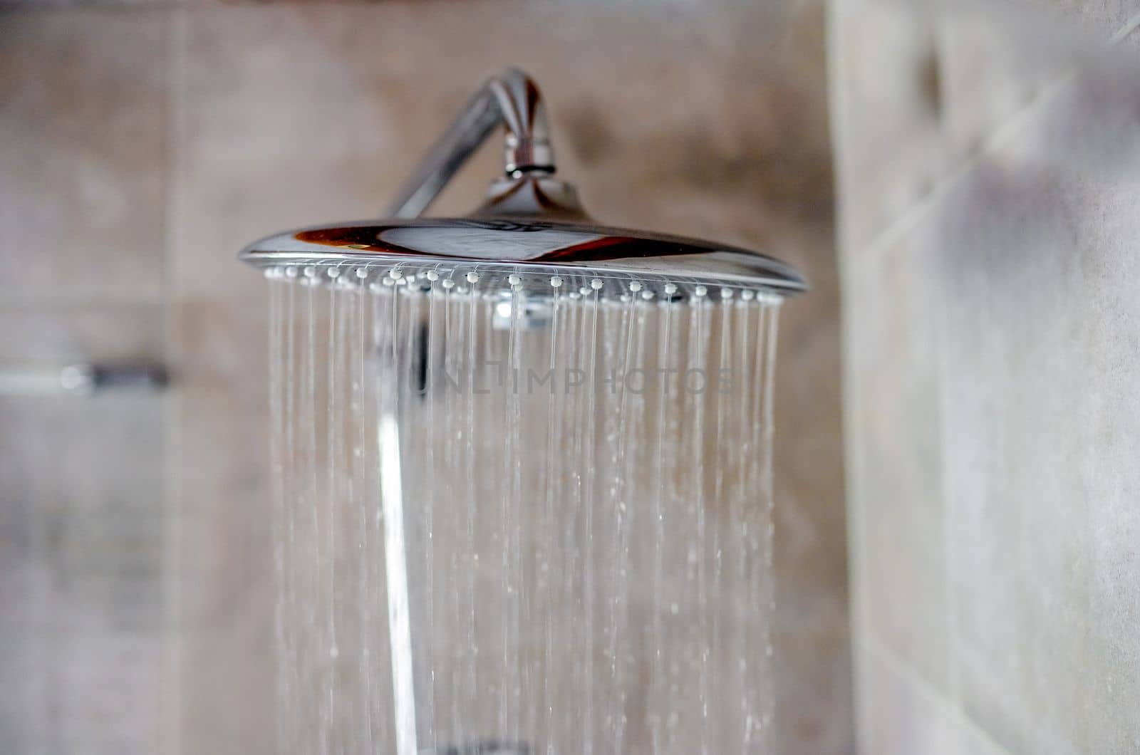 Fresh shower with water drops splashing. Water running from shower head