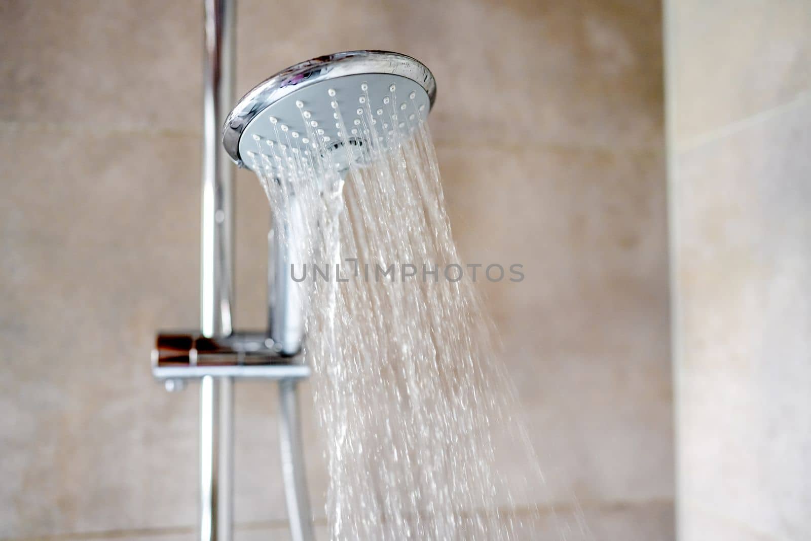Fresh shower with water drops splashing. Water running from shower head