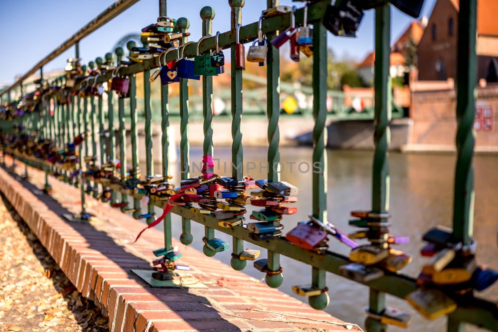 Padlocks hanging on Tumski bridge in Wroclaw by tan4ikk1