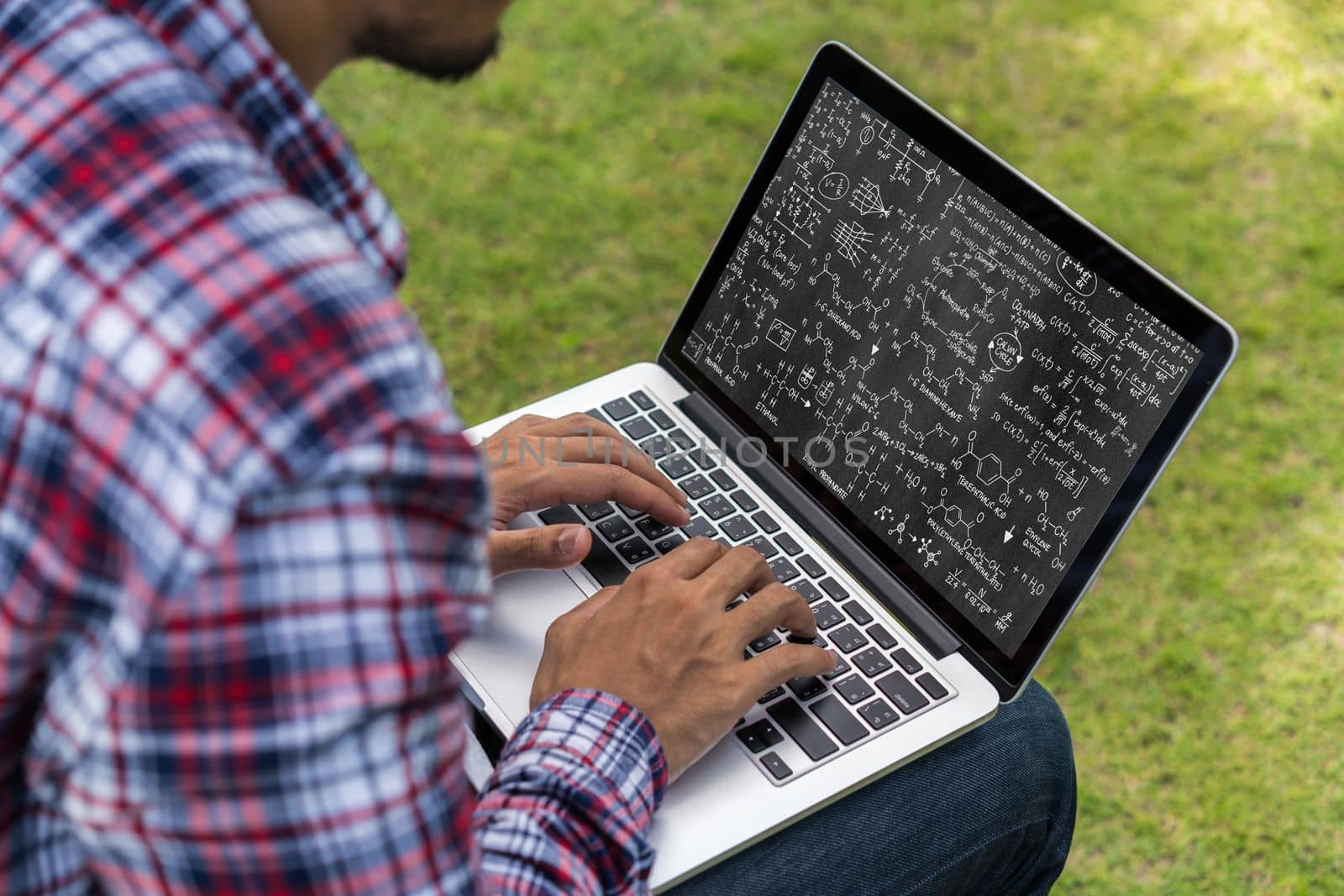 Mathematic equations and modish formula on computer screen showing concept of science and education