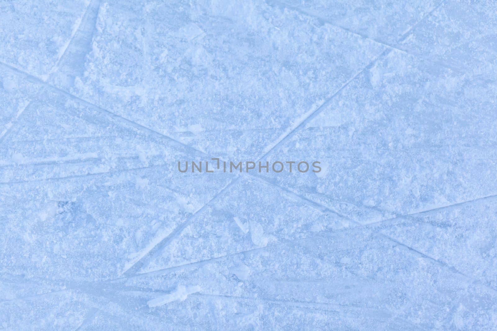 Empty ice rink with skate marks after the session outdoor. by AnatoliiFoto