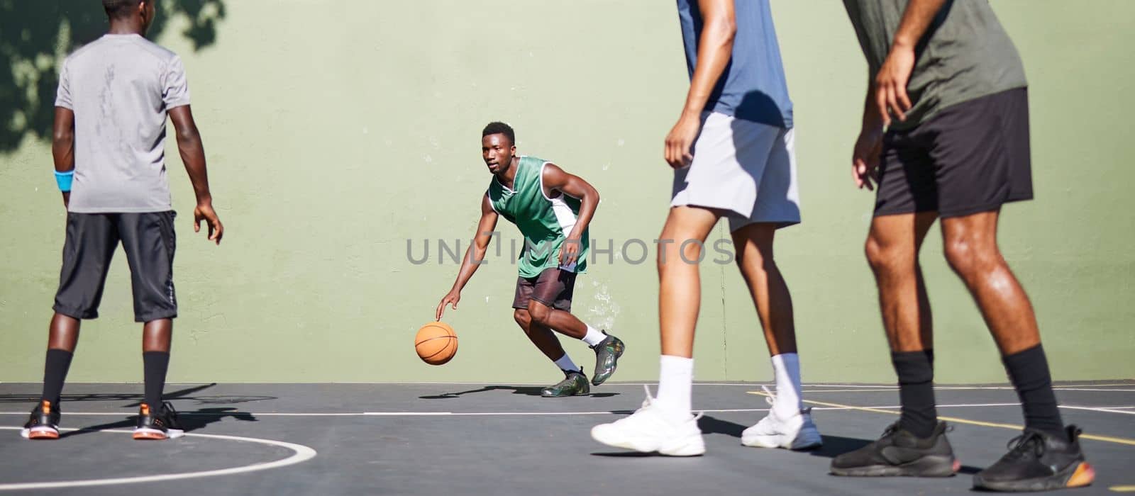 Sports, training and teamwork with man on basketball court for fitness, workout and exercise. Cardio, summer and friends with basketball player for energy, stamina and endurance in competition games.