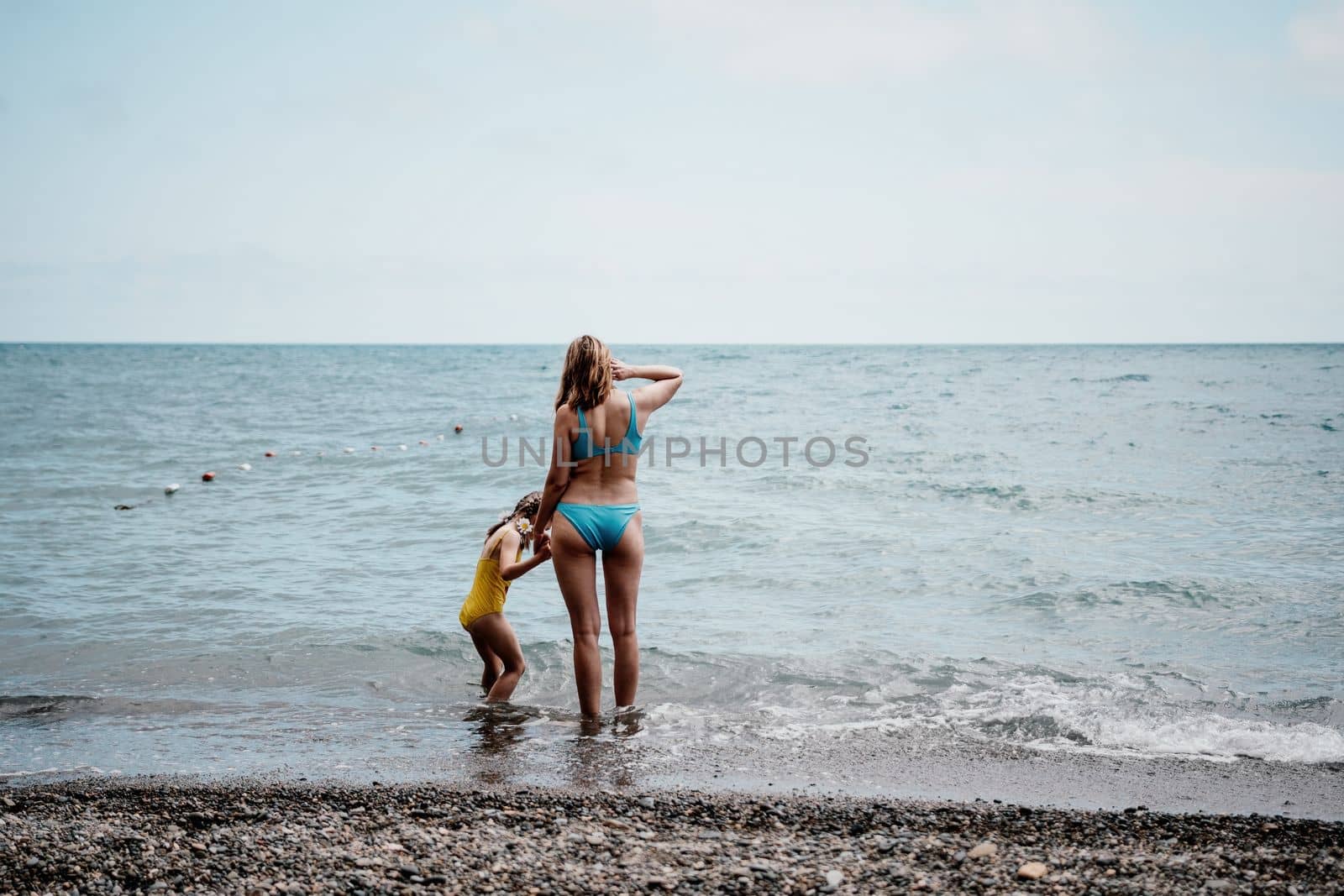 Happy loving family mother and daughter having fun together on t by panophotograph