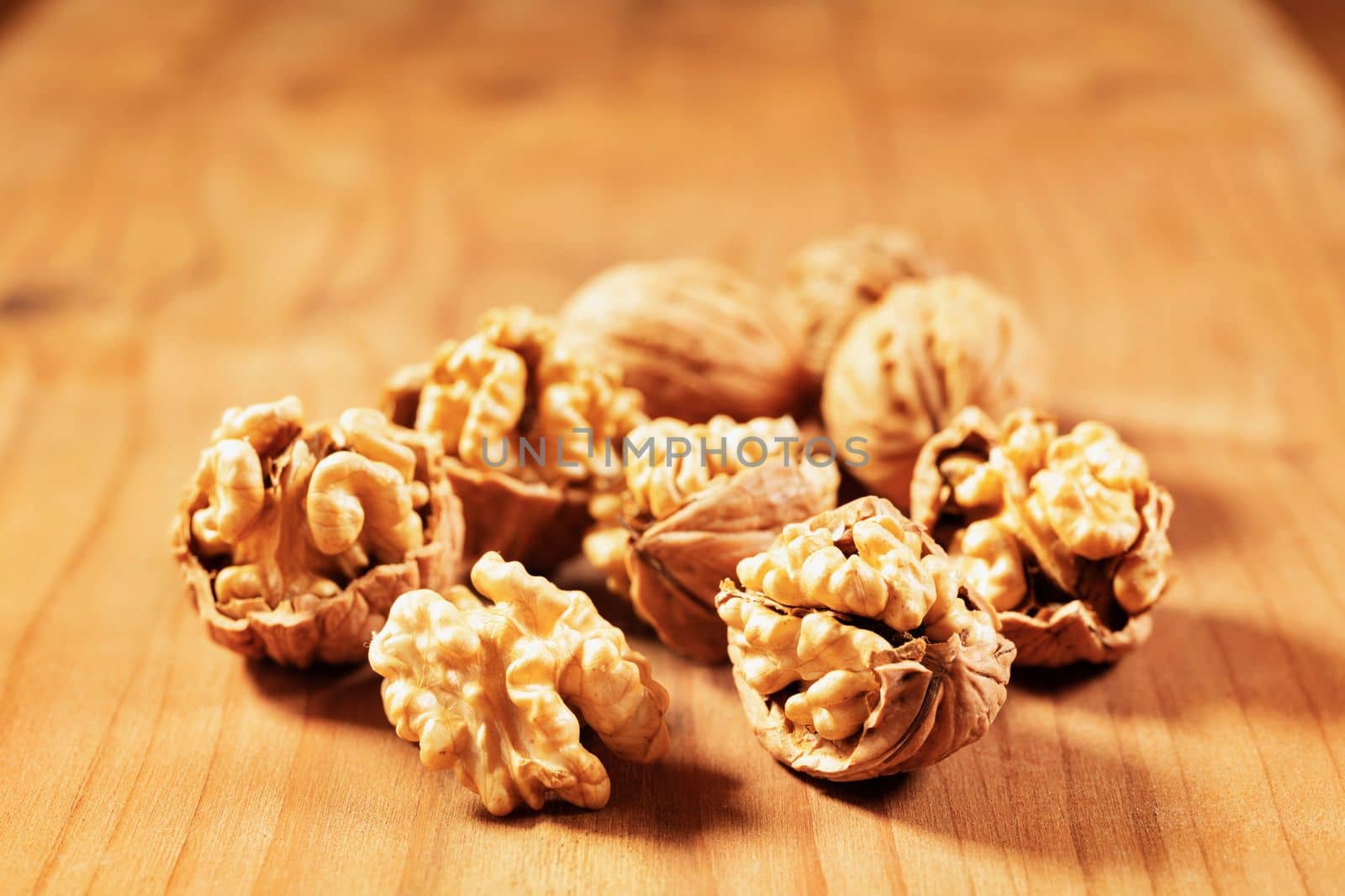 Opened walnuts  on wooden table  , healthy eating