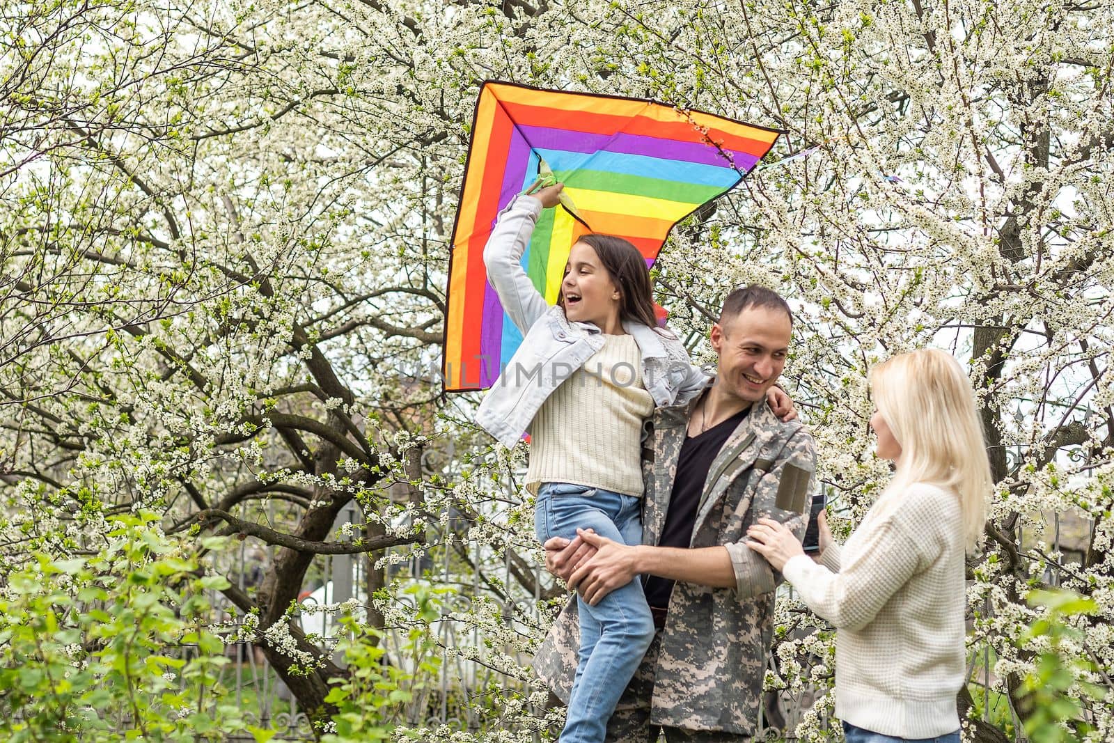 Family Welcoming Husband Home On Army Leave