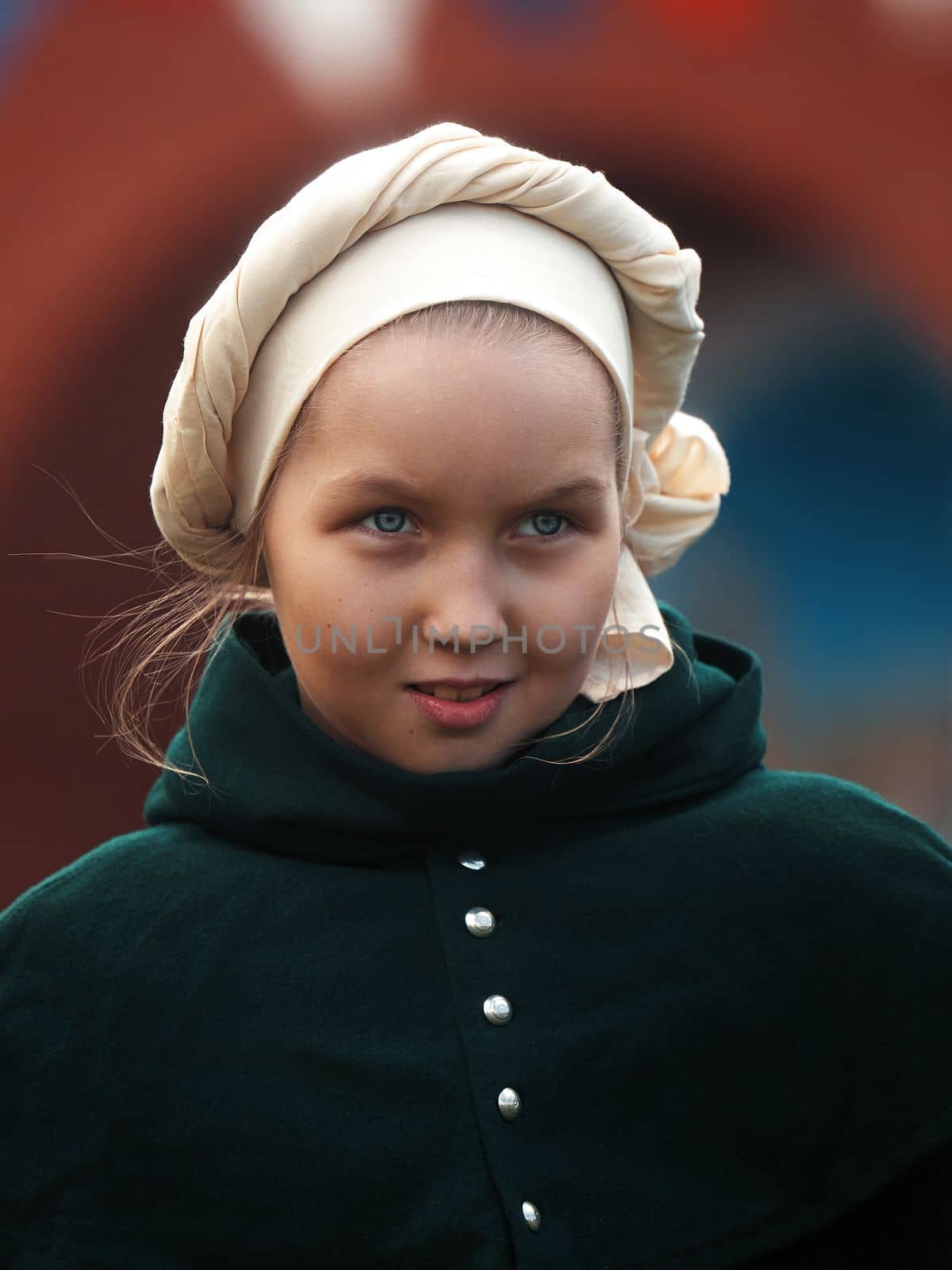 Portrait of a young girl in a medieval castle. A little girl in medieval dress walking through a yard. historical reconstruction. 14.05,2022. Yoshkar-Ola, Russia by EvgeniyQW