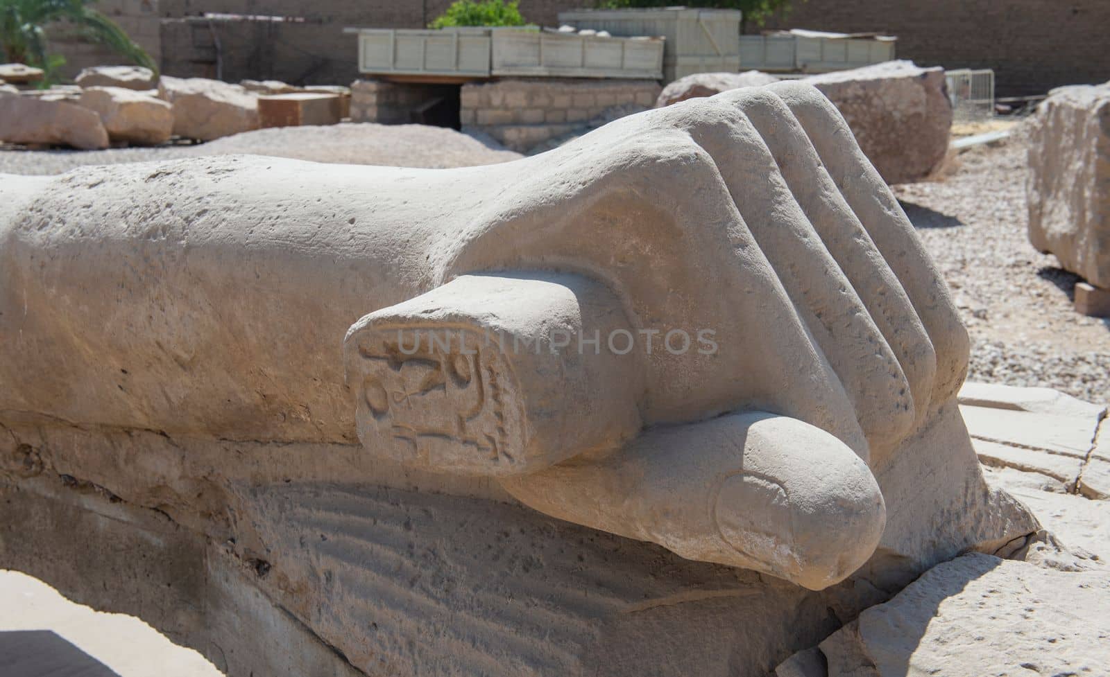 Large broken statue of Ramses 2nd at Karnak temple in Egypt by paulvinten