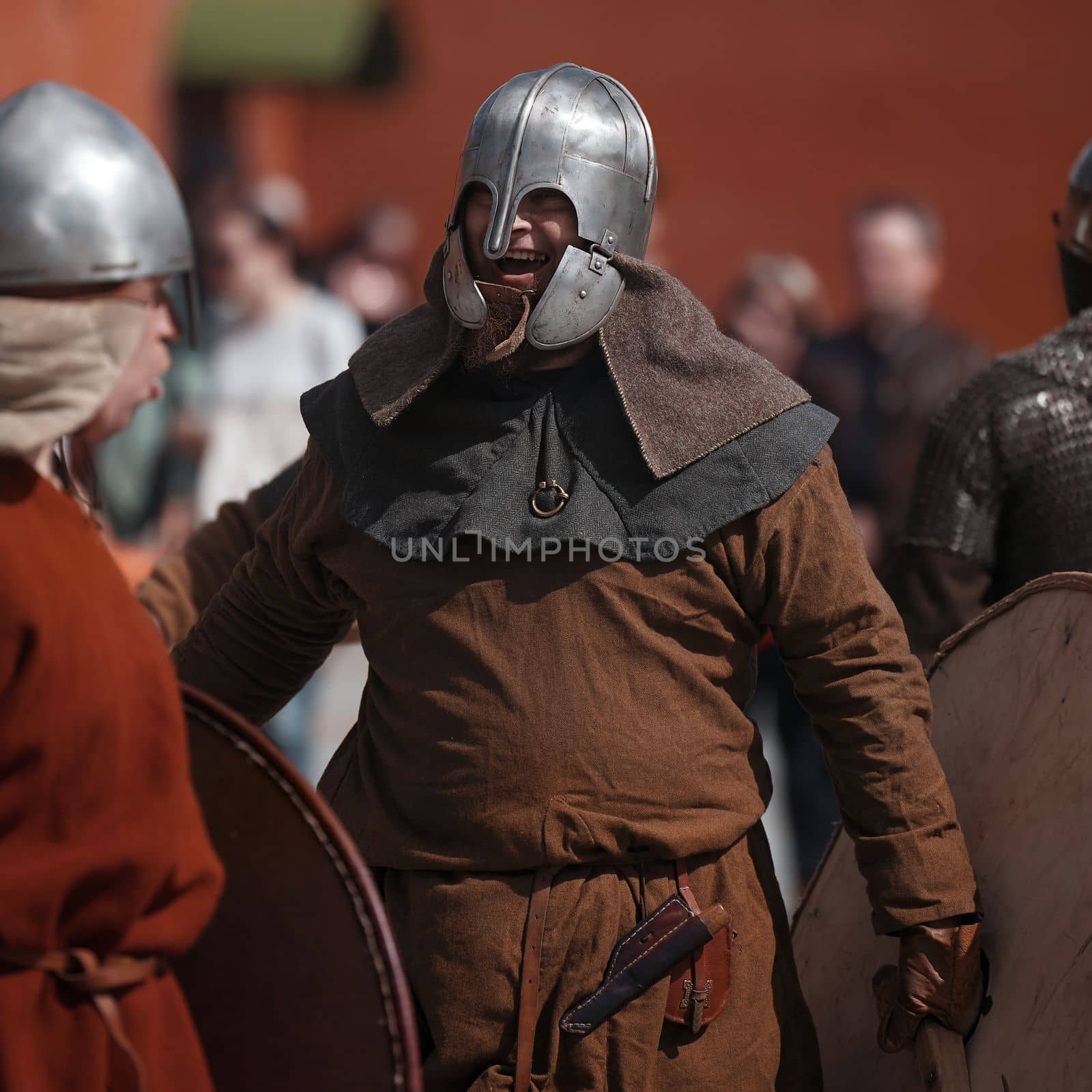 Warrior in helmet in medieval dress. Warrior of medieval Europe. Medieval battle - Historical reconstruction. Medieval tournament. 14.05,2022. Yoshkar-Ola, Russia. by EvgeniyQW
