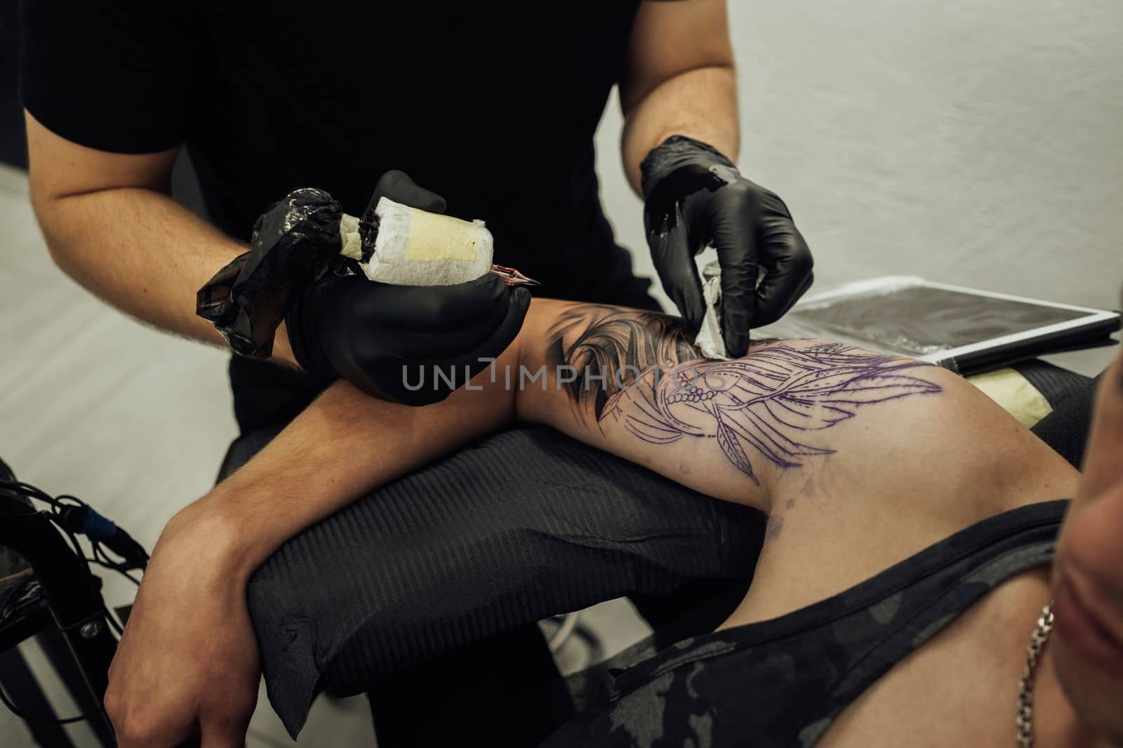 Male Tattoo Artist Draws on the Client Skin, Creating Tattoo process by Romvy