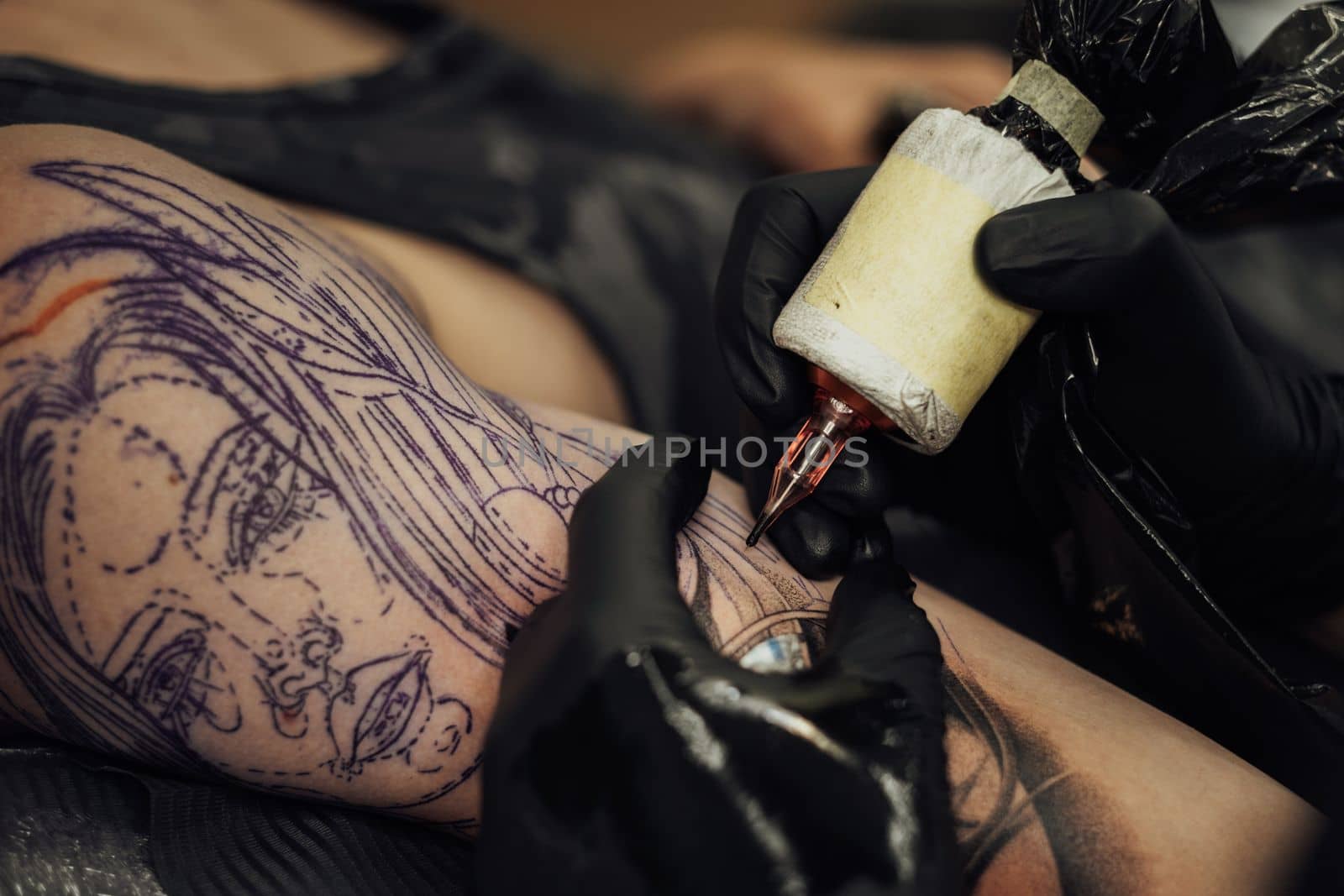 Close Up of Process of Creating Tattoo Art, Artist Draws on Clients Skin