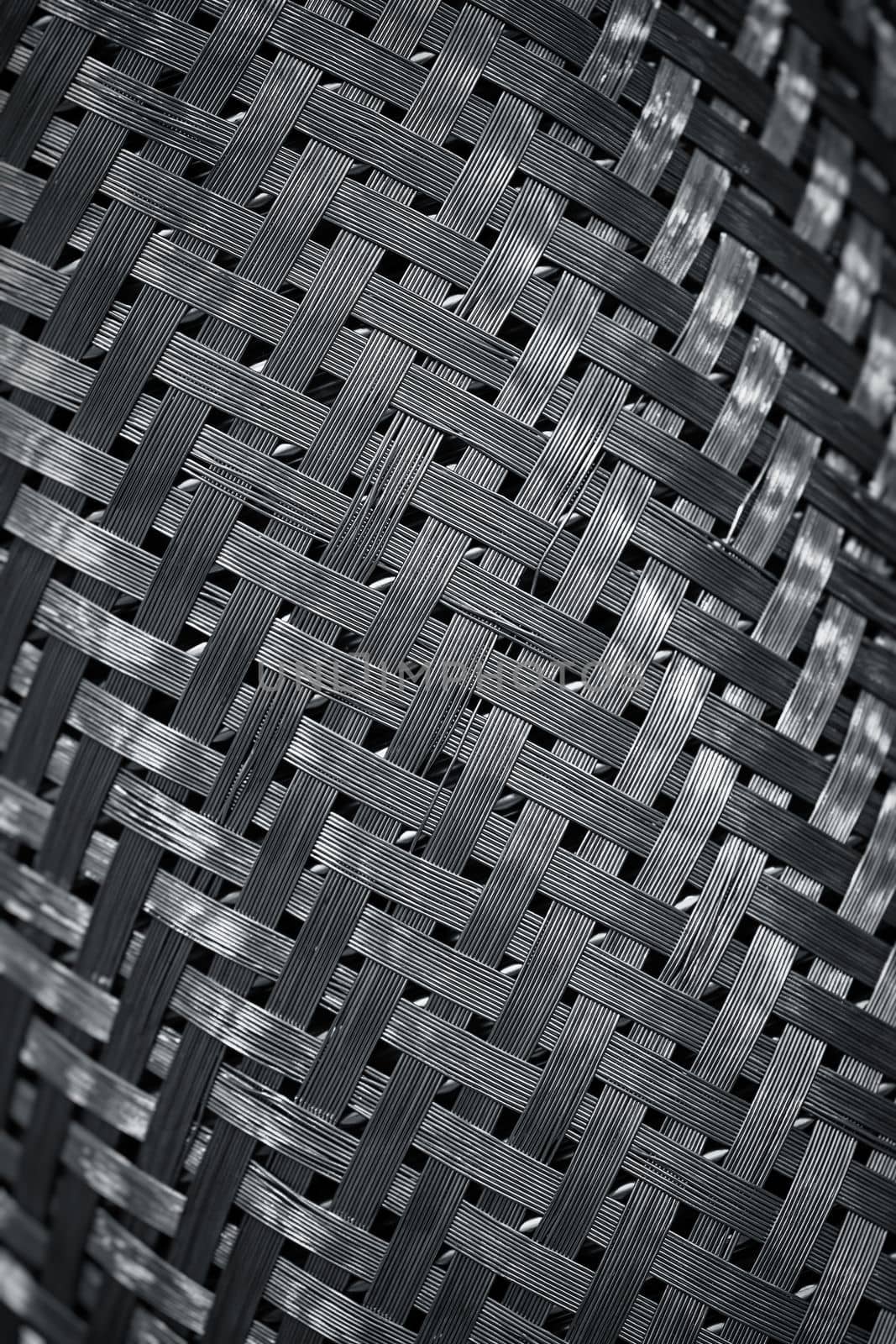 Protective metal braid, steel mesh. Metal wire - abstract background. Metal products and designs. Steel protective sheath braided cable.