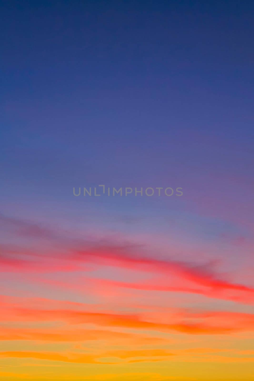 Amazing colorful pink violet orange red yellow blue and purple sunset sky panorama in Leherheide Bremerhaven Germany.