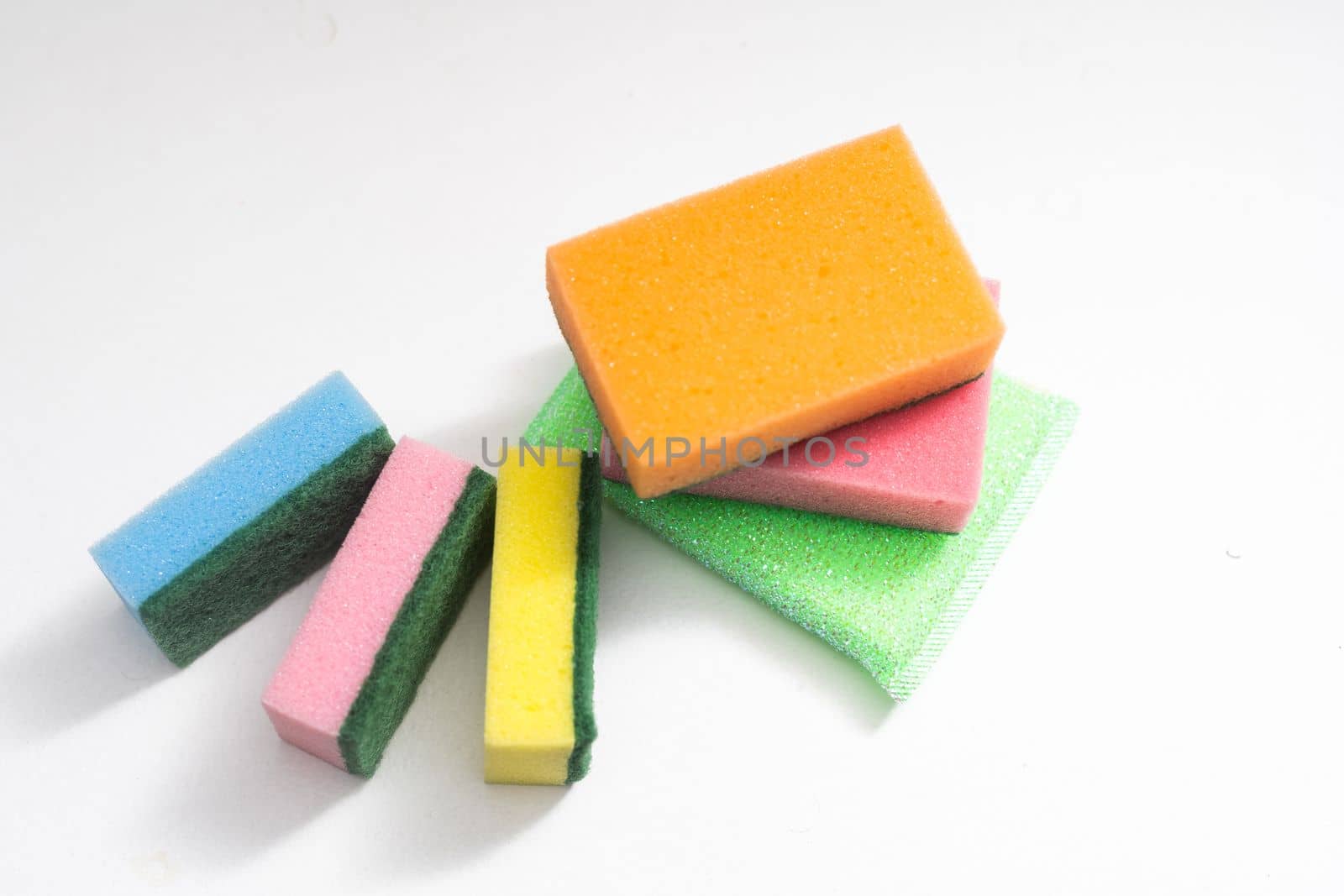 Kitchen dishcloth, cleanup concept, housework. Colorful kitchen sponges for cleaning close-up, housekeeping. by Andelov13