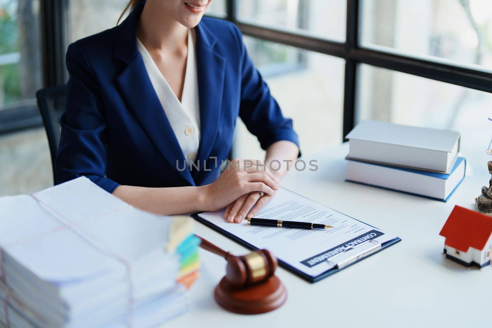 Law, Consultation, Agreement, Contract, Concept Attorney or Lawyer is sitting and accepting complaints from clients for home and land matters in court. by Manastrong