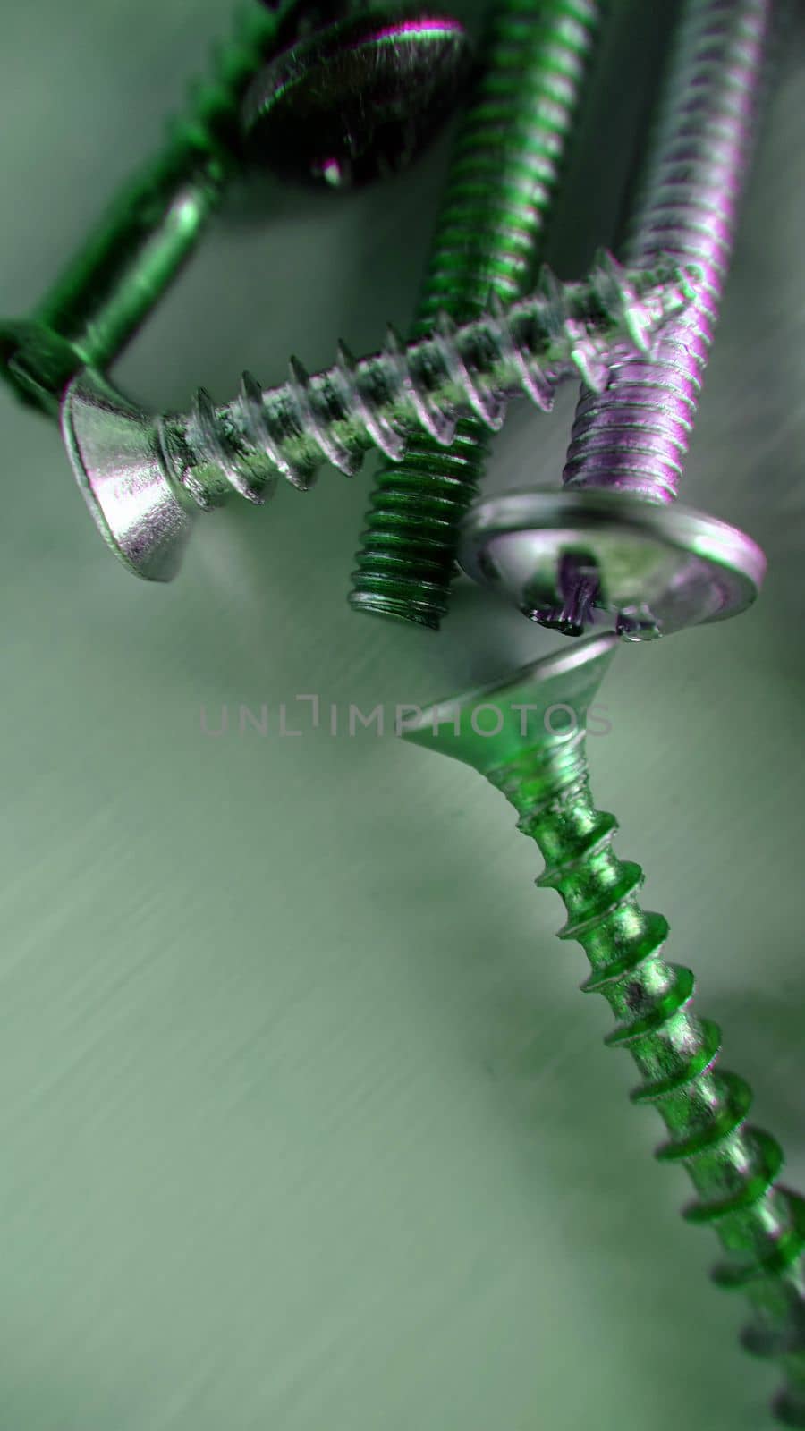 Background image of screws bolts of different sizes on the table by Mastak80