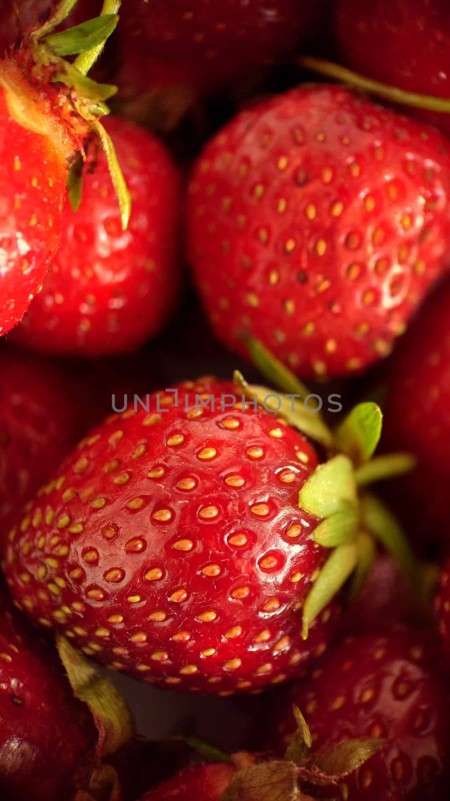 Ripe juicy red strawberries close-up, selective focus.Macro photography.Texture or background.Selective focus.