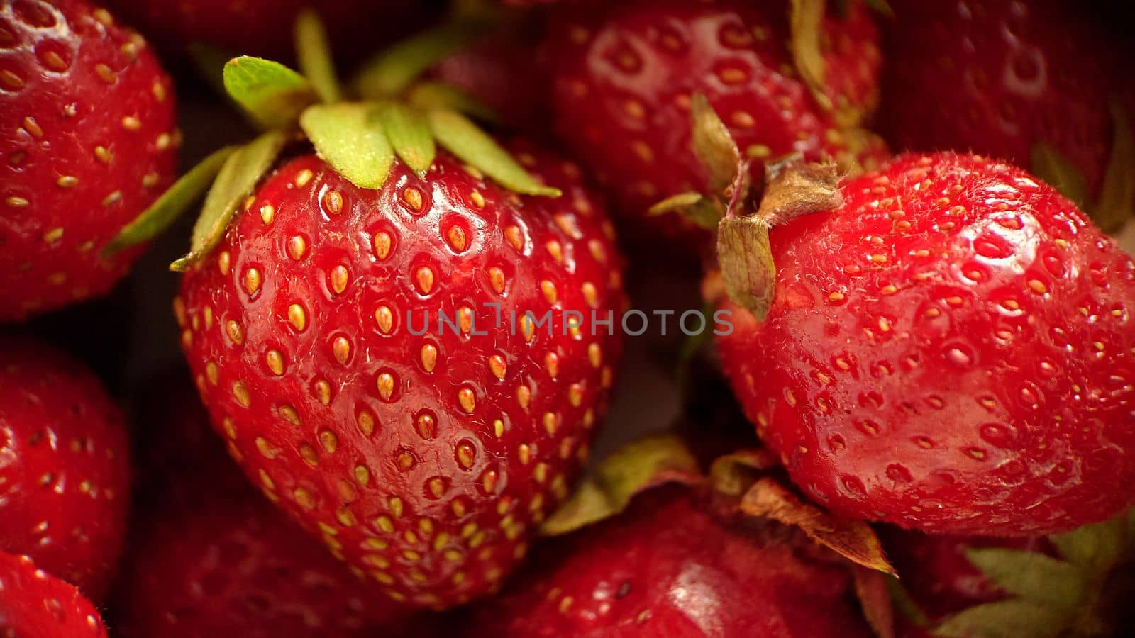 Ripe juicy red strawberries close-up, selective focus.Macro photography.Texture or background.Selective focus.