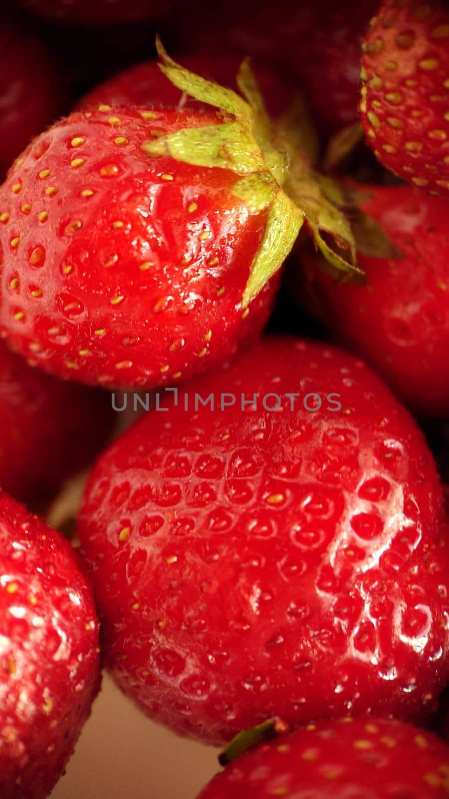 Ripe red strawberry berry selective focus close-up.Macrophotography.Texture or background. Selective focus.