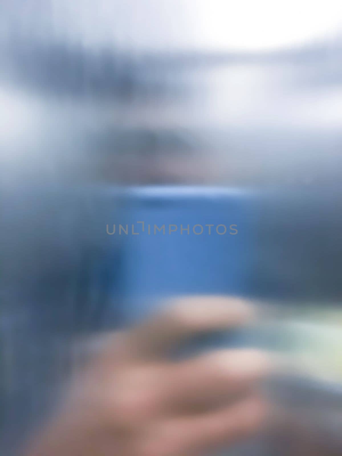 Blurry image of a person taking selfie