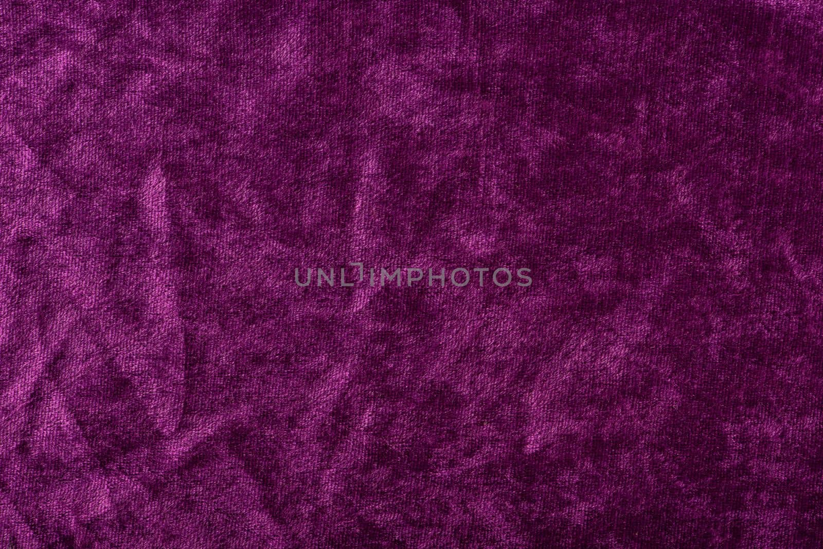 Beautiful purple silk satin background. Soft folds on a shiny fabric. Birthday, Christmas, Valentine's Day. Luxury background with copy space for text, design, web banner