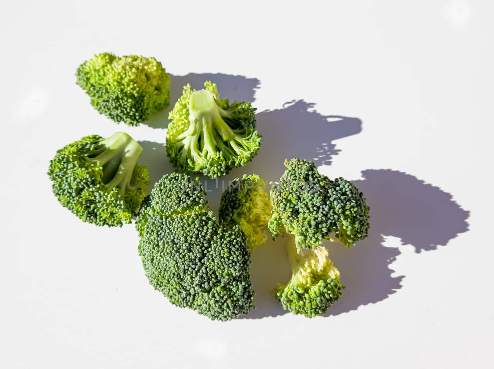 Broccoli sprig on colored background, asparagus cabbage isolated. Perfect Sprig of Fresh Broccoli.