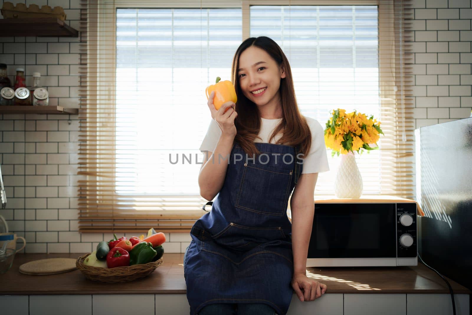 Portrait of beautiful young asian woman making salad at home. cooking food and Lifestyle moment by itchaznong