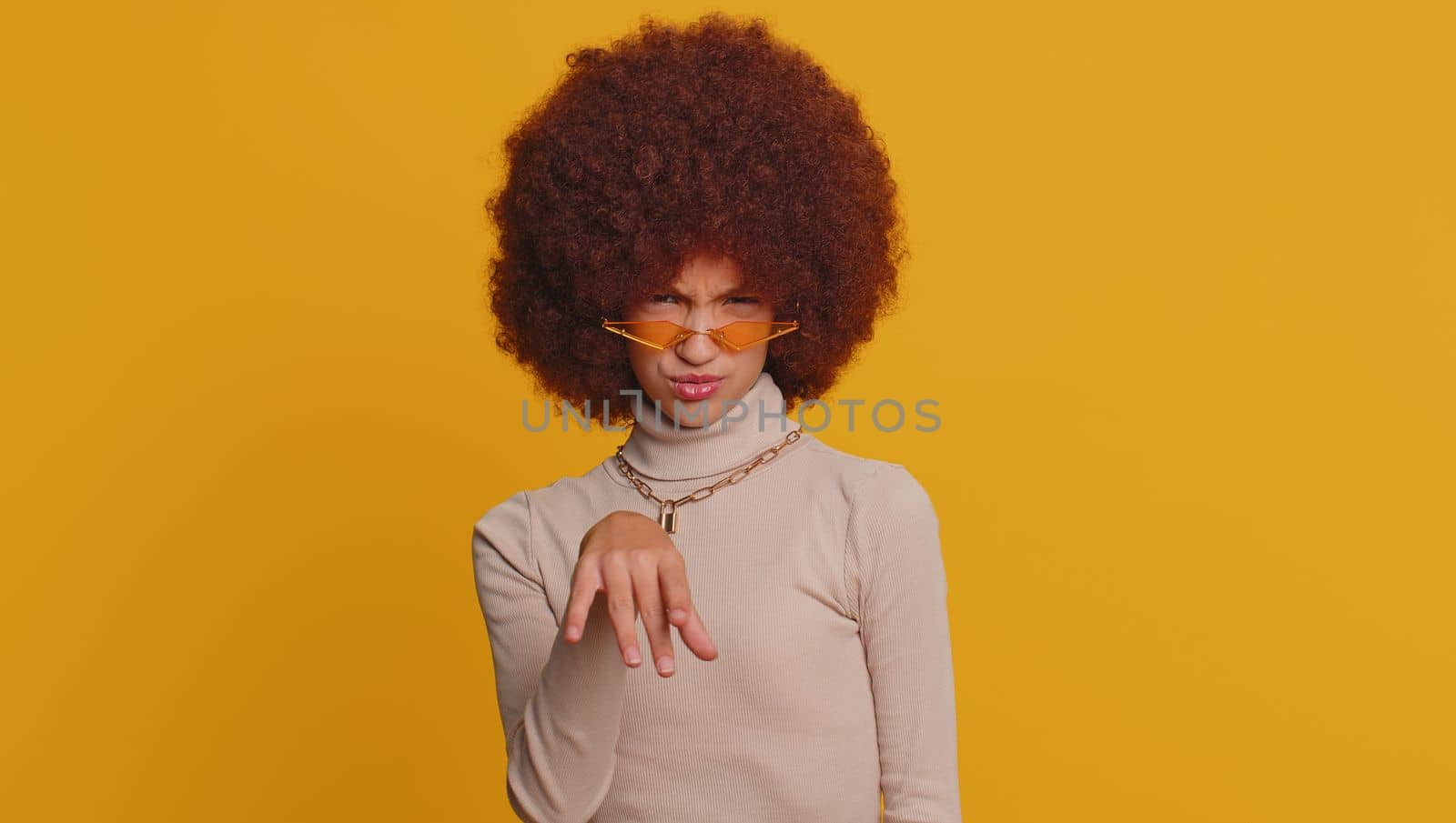 Displeased upset young teenager child girl kid reacting to unpleasant awful idea, dissatisfied with bad quality, wave hand, shake head No, dismiss idea, dont like proposal. Little one funny children
