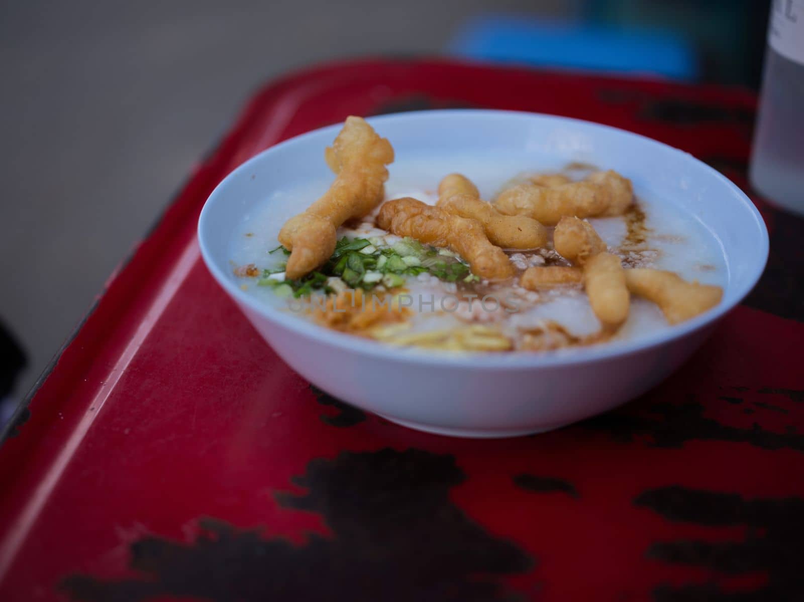 Chinese porridge with egg in a bowel with chinese donughnut . Concept breakfast set for marketing