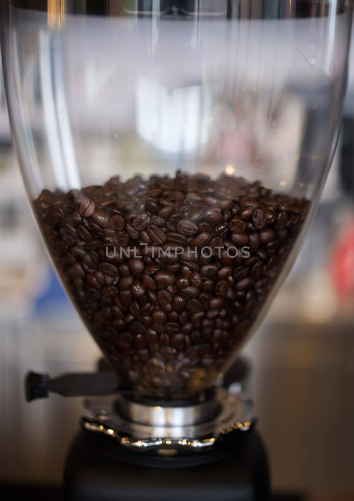 Coffee beans in coffe grinder . Space for text.  Concept cafe by Hepjam