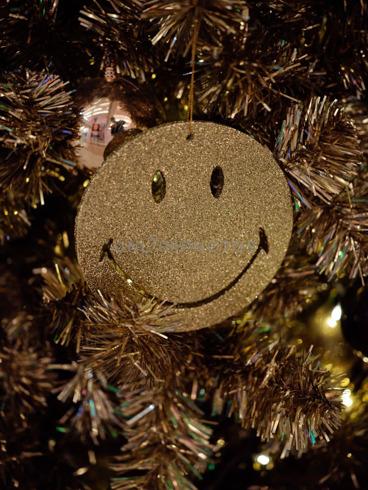 Christmas and Happy new year on  christmas tree . Golden tone . SPACE FOR TEXT 